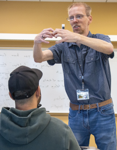 TR philosophy professor Mark Anderson uses his student Henry Knauf as a subject in a brain exercise metaphor describing it’s functions.